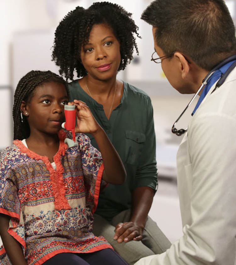 African American asthma patient with a doctor