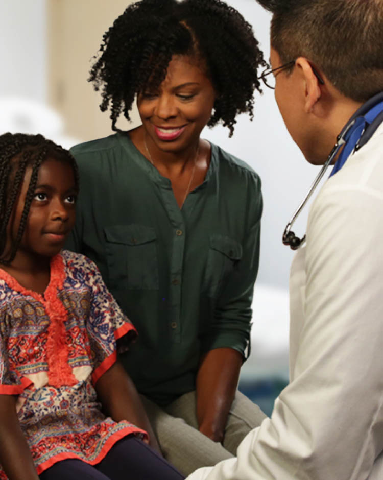 African American child with Asthma talking to a doctor